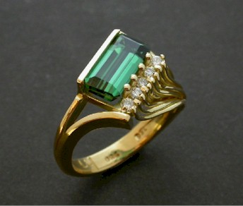 Blue Green Tourmaline set in a artistic 18ct designer ring